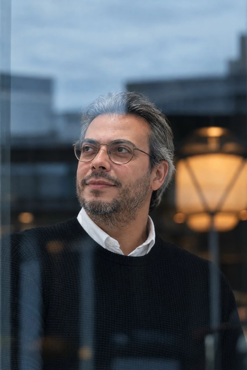 Dr. Ahmed Mohamady beside a window.